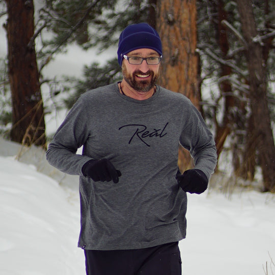 The heather grey of the Men's Long Sleeve Blue Ridge shirt suggests comfort. The Poly/Lycra/Tencel blended fabric delivers the comfort. You can wear this shirt during your run, before your workout or race. It is best worn while making the walk up to the podium afterwards.