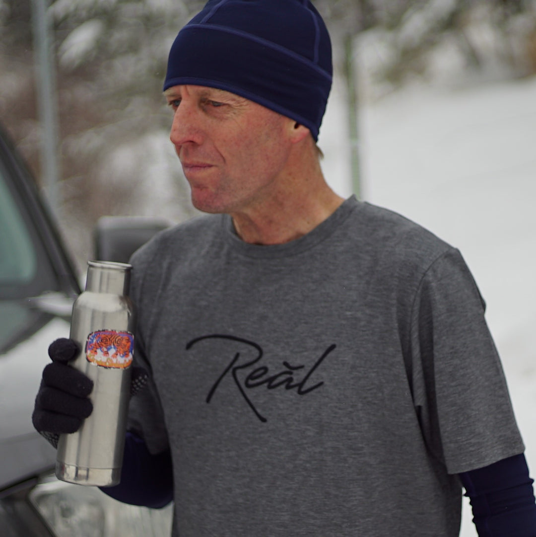 The heather grey of the Men's Blue Ridge shirt suggests comfort.  The Poly/Lycra/Tencel blended fabric delivers the comfort.  You can wear this shirt during your run, before your workout or race.  It is best worn while making the walk up to the podium afterwards.