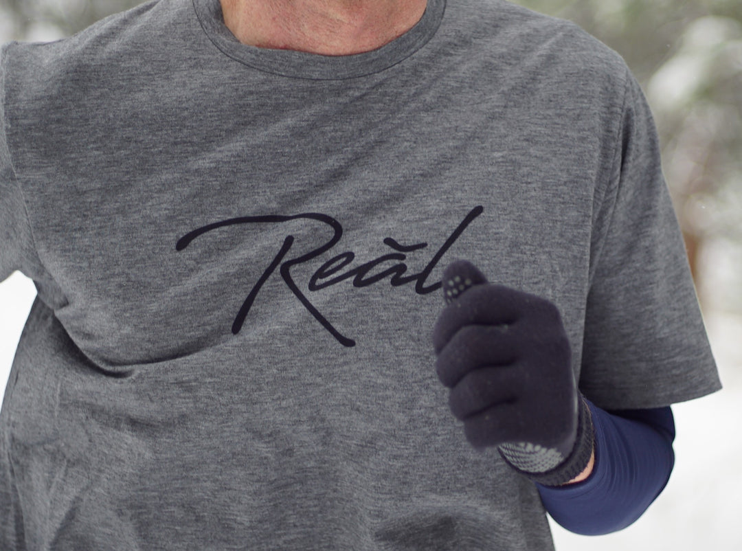The heather grey of the Men's Blue Ridge shirt suggests comfort. The Poly/Lycra/Tencel blended fabric delivers the comfort. You can wear this shirt during your run, before your workout or race. It is best worn while making the walk up to the podium afterwards.